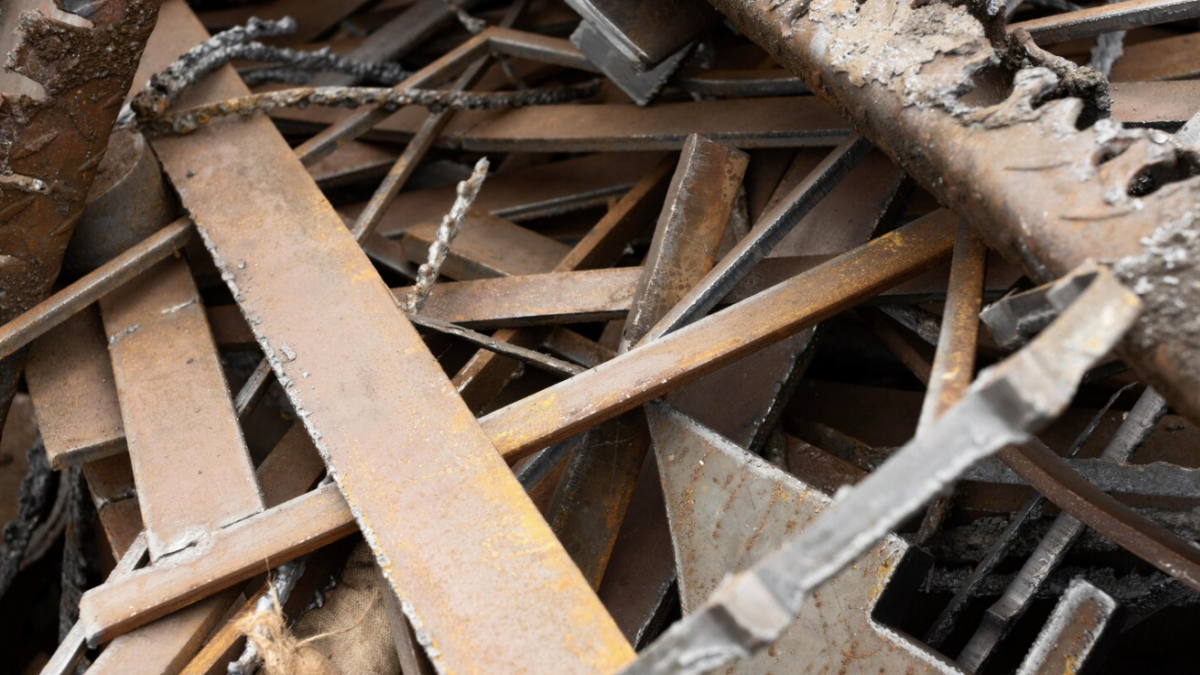Home renovation debris including wood, drywall, fixtures, and construction materials awaiting removal.